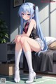 A girl with long blue hair sitting on a bed.