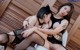 A couple of women sitting on top of a white chair.